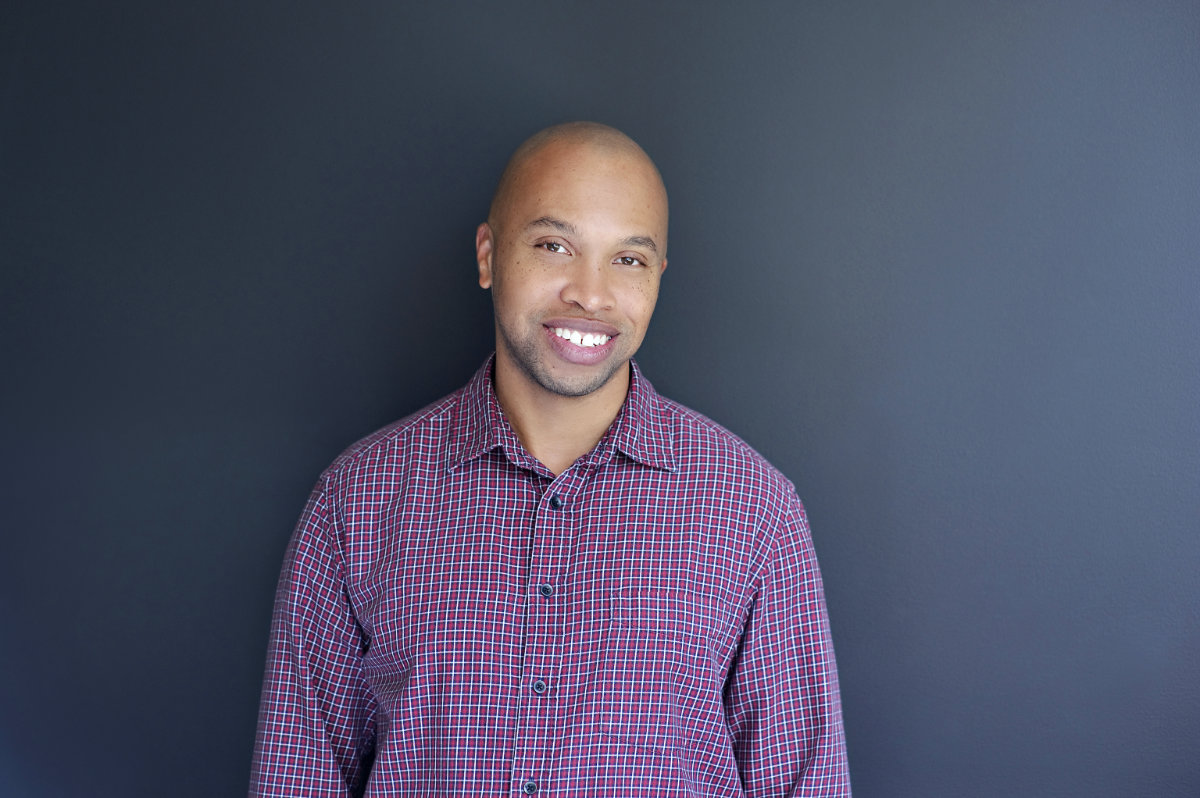 Headshot of Matt Jenkins, landscape, in red button down shirt.