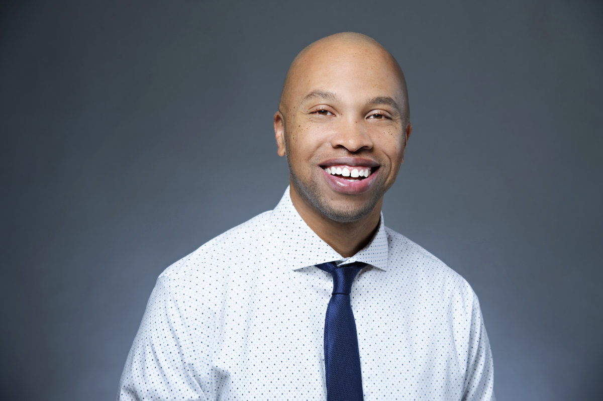 Headshot of Matt Jenkins, landscape, in shirt and tie.