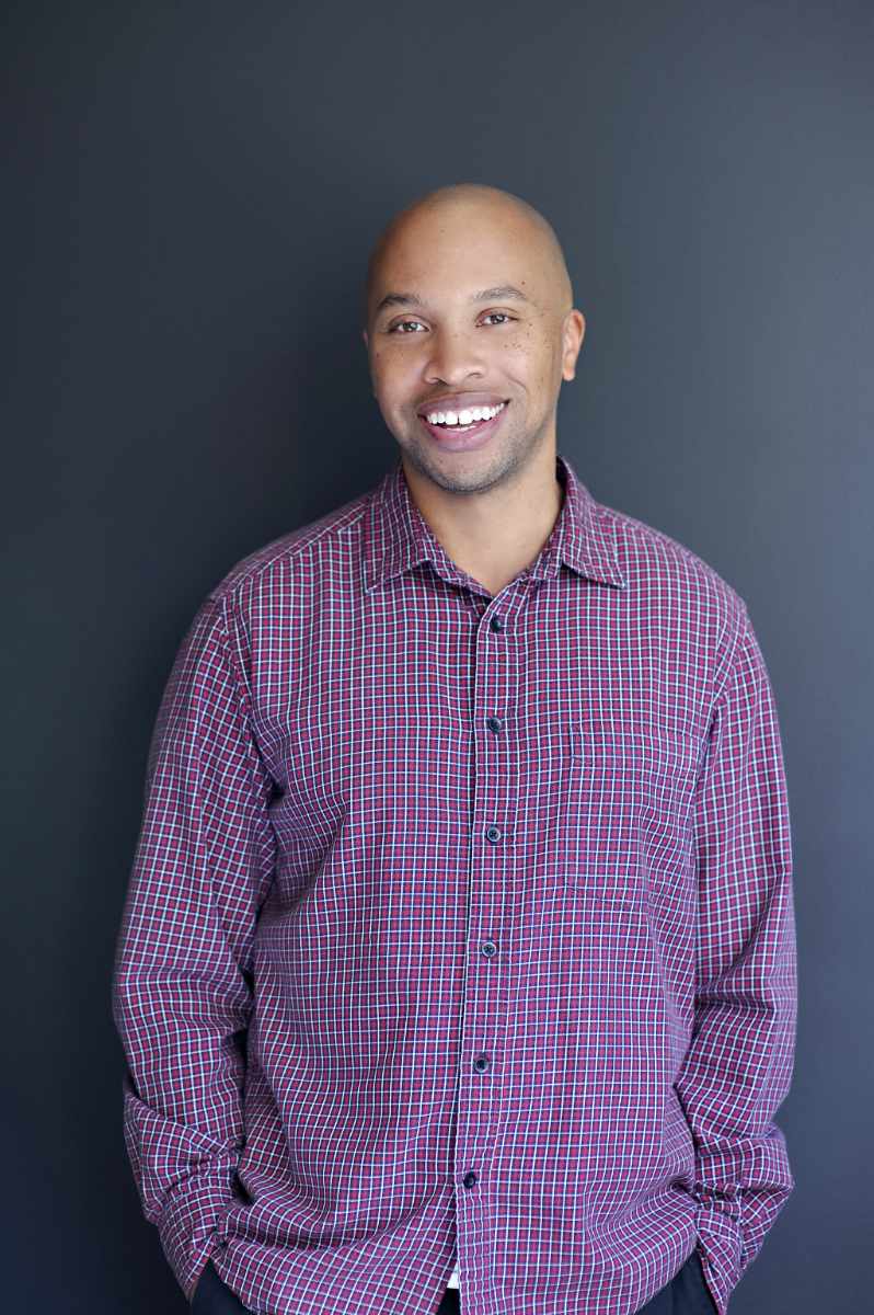 Headshot of Matt Jenkins, portrait, in red button down shirt.